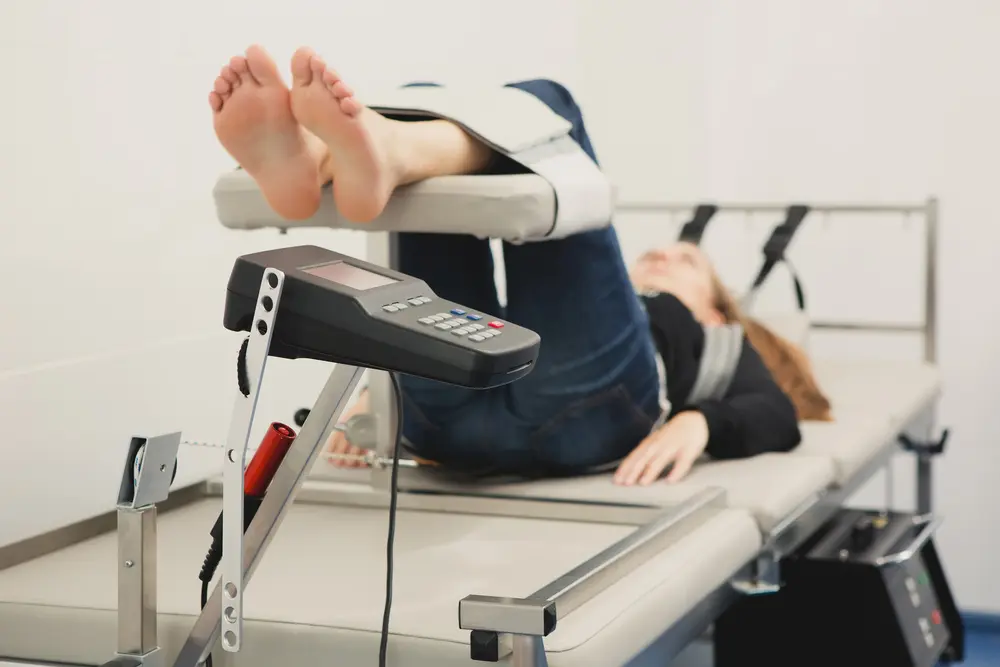 Image of woman receiving spinal decompression therapy in Chiropractors in Phoenix.