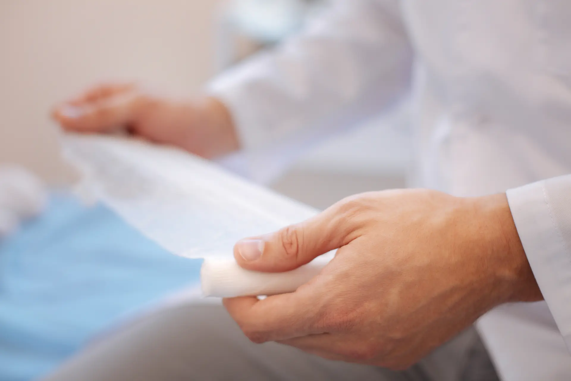 a doctor holds a bandage