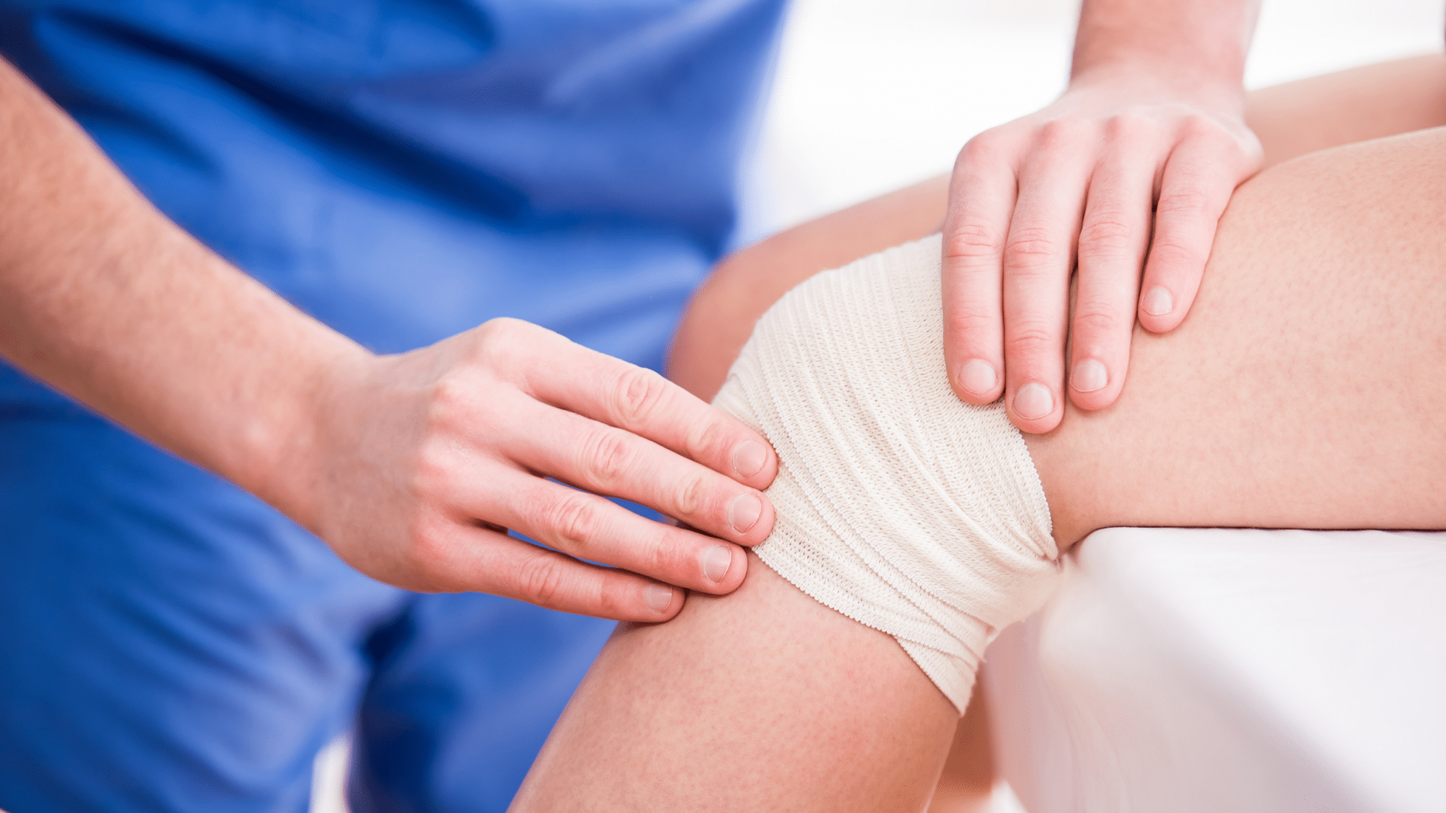 Provider examining a wrapped knee
