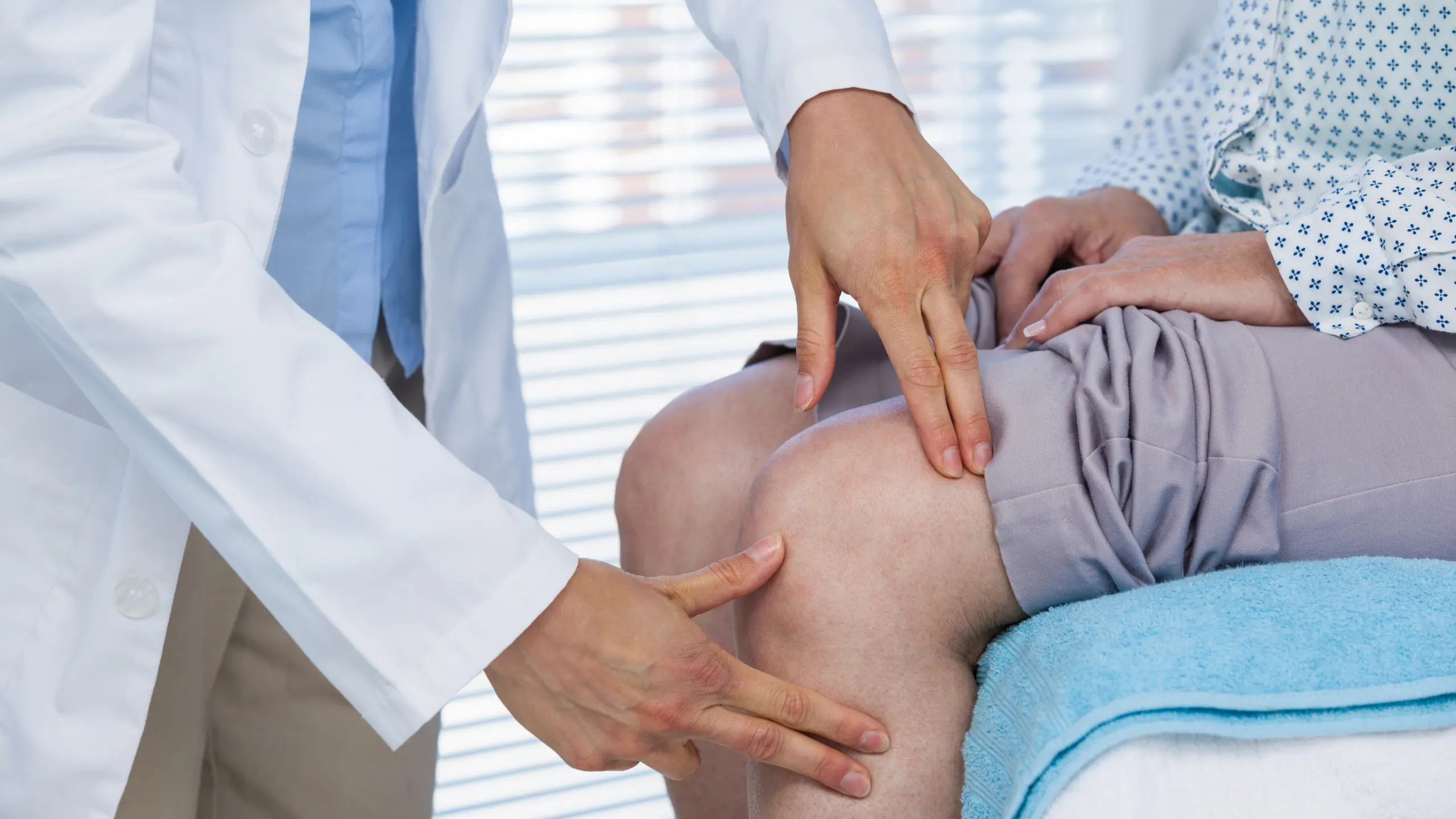 Doctor examining a patient's knee