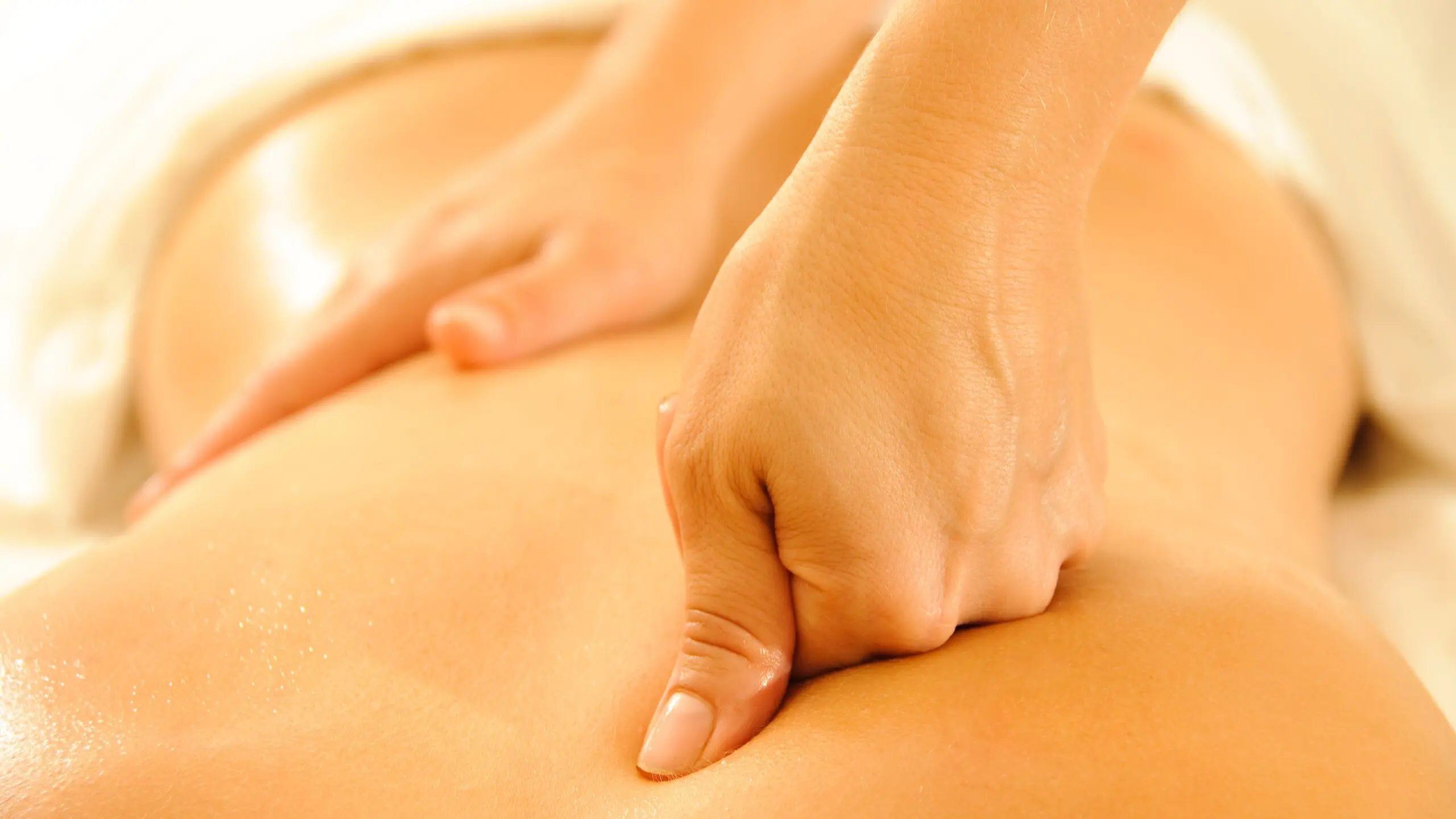 Woman receiving massage therapy treatment