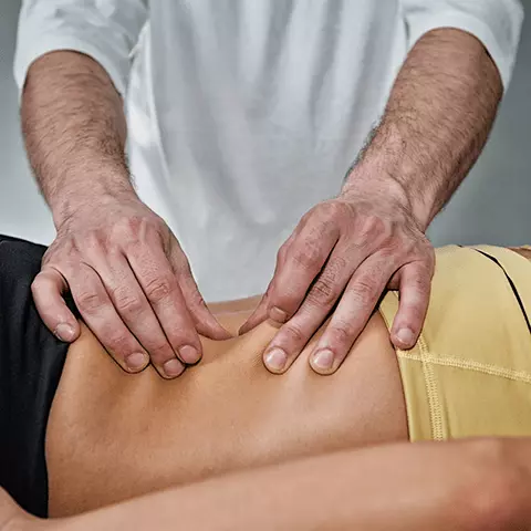 Woman laying on table getting a massage