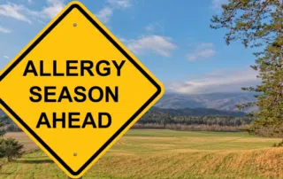 sign that says allergy season ahead