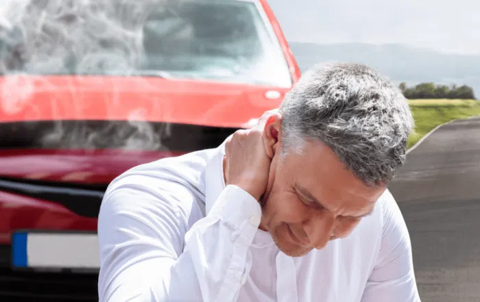 man holding neck in pain after a car wreck