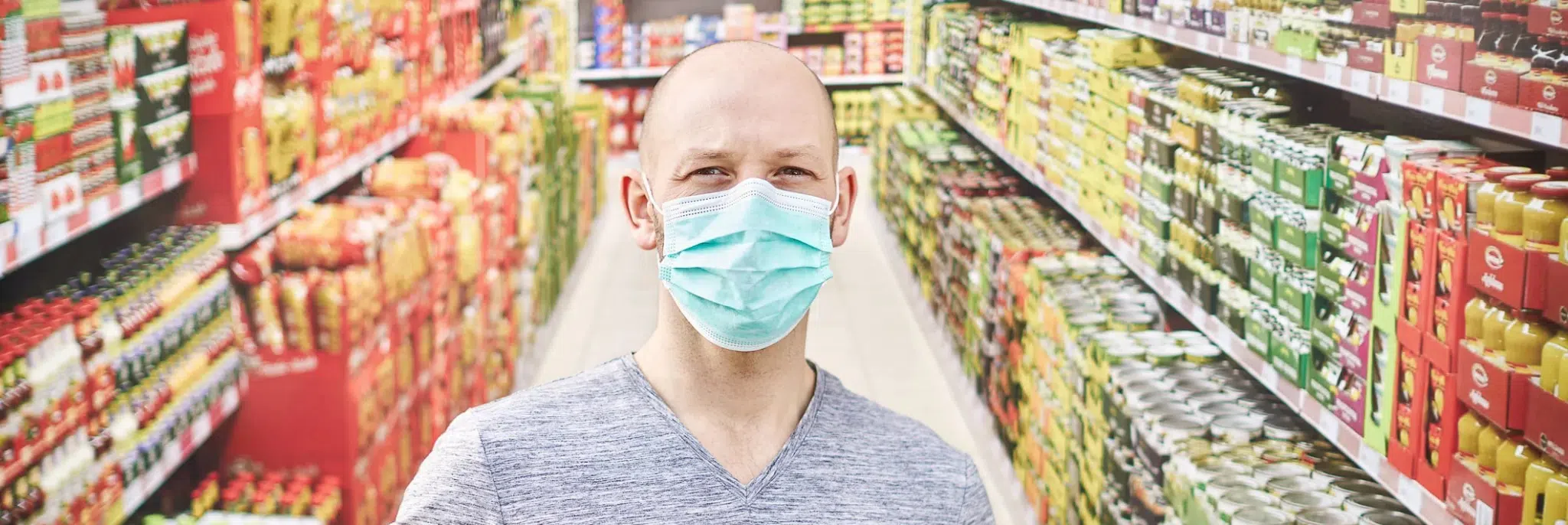 Man in grocery store with face mask on
