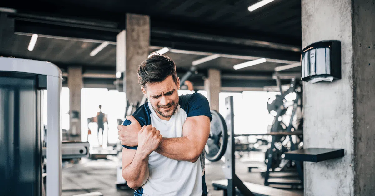 man with sports injury in gym