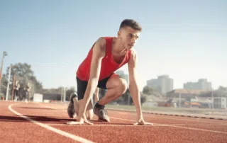 track runner at the starting line