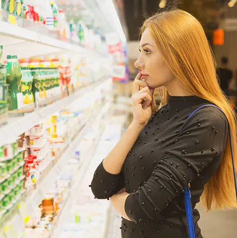 woman picking food at market